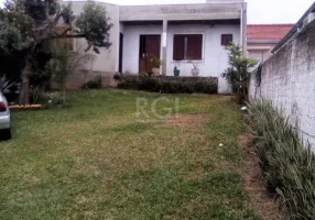 Foto 1 de Casa com 4 Quartos à venda, 130m² em Santa Fé, Porto Alegre