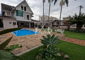 Foto 1 de Sobrado com 5 Quartos para venda ou aluguel, 181m² em Indaiá, Caraguatatuba