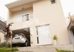 Foto 1 de Casa de Condomínio com 3 Quartos à venda, 195m² em Vila Nova, Porto Alegre