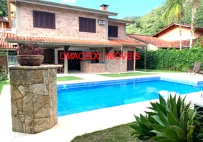 Foto 1 de Casa de Condomínio com 5 Quartos à venda, 361m² em Lagoinha, Ubatuba