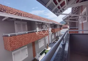 Foto 1 de Sobrado com 2 Quartos à venda, 82m² em Martim de Sa, Caraguatatuba