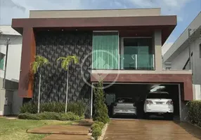 Foto 1 de Casa de Condomínio com 4 Quartos à venda, 338m² em Jardins Madri, Goiânia