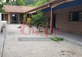 Foto 1 de Casa com 5 Quartos para alugar, 345m² em Massaguaçu, Caraguatatuba