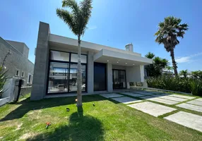 Foto 1 de Casa de Condomínio com 4 Quartos à venda, 185m² em Arco Iris, Capão da Canoa