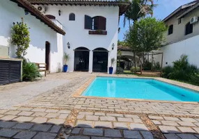 Foto 1 de Casa com 4 Quartos à venda, 380m² em Enseada, Guarujá