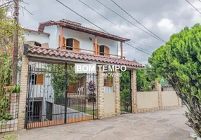 Foto 1 de Sobrado com 4 Quartos à venda, 258m² em Santa Fé, Porto Alegre