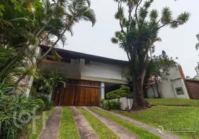 Foto 1 de Casa com 4 Quartos à venda, 440m² em Auxiliadora, Porto Alegre