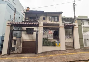 Foto 1 de Casa com 4 Quartos à venda, 256m² em Santo Antônio, Porto Alegre