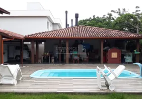 Foto 1 de Casa de Condomínio com 4 Quartos à venda, 330m² em Lagoa da Conceição, Florianópolis