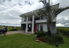 Foto 1 de Casa de Condomínio com 4 Quartos à venda, 200m² em Capao Novo, Capão da Canoa