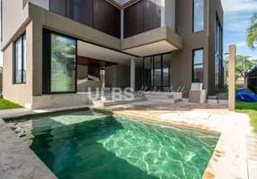 Foto 1 de Casa de Condomínio com 4 Quartos à venda, 340m² em Jardins Valencia, Goiânia