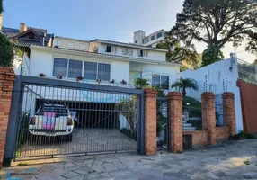 Foto 1 de Casa com 5 Quartos para venda ou aluguel, 440m² em Três Figueiras, Porto Alegre