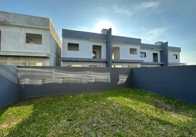 Foto 1 de Sobrado com 2 Quartos à venda, 74m² em Arco Iris, Capão da Canoa