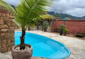 Foto 1 de Casa com 4 Quartos à venda, 256m² em Massaguaçu, Caraguatatuba