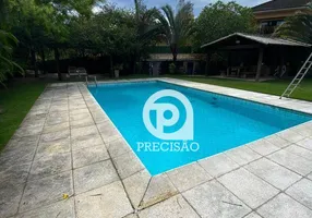 Foto 1 de Casa de Condomínio com 5 Quartos para venda ou aluguel, 900m² em Barra da Tijuca, Rio de Janeiro