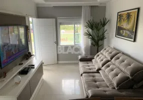 Foto 1 de Casa com 2 Quartos à venda, 65m² em Faxinal, Torres