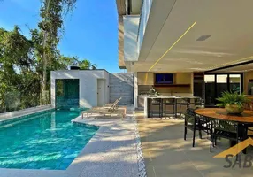 Foto 1 de Casa de Condomínio com 6 Quartos à venda, 380m² em Riviera de São Lourenço, Bertioga