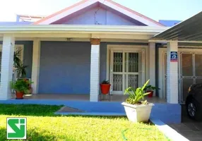 Foto 1 de Casa com 5 Quartos à venda, 289m² em Cavalhada, Porto Alegre