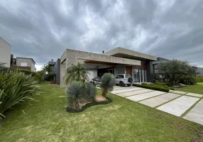 Foto 1 de Casa de Condomínio com 4 Quartos à venda, 300m² em Atlantida Sul, Osório
