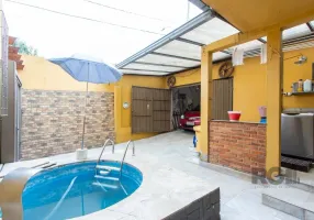 Foto 1 de Casa com 3 Quartos à venda, 89m² em Vila Nova, Porto Alegre