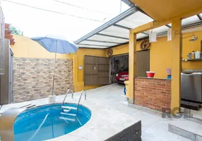 Foto 1 de Casa com 3 Quartos à venda, 91m² em Vila Nova, Porto Alegre