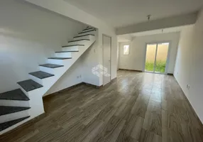 Foto 1 de Casa de Condomínio com 2 Quartos à venda, 74m² em Vila Nova, Porto Alegre