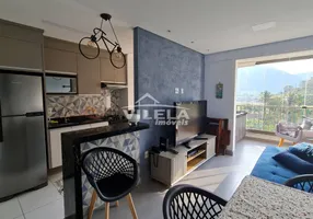 Foto 1 de Apartamento com 2 Quartos para venda ou aluguel, 59m² em Martim de Sa, Caraguatatuba