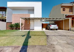 Foto 1 de Sobrado com 3 Quartos à venda, 231m² em Campo Novo, Porto Alegre