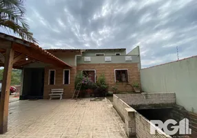 Foto 1 de Casa com 3 Quartos à venda, 883m² em Campo Novo, Porto Alegre