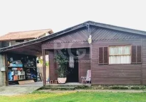 Foto 1 de Casa com 2 Quartos à venda, 51m² em Vila Nova, Porto Alegre