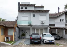 Foto 1 de Casa de Condomínio com 4 Quartos à venda, 165m² em Vila Nova, Porto Alegre