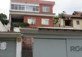 Foto 1 de Casa com 5 Quartos à venda, 241m² em Jardim Itú Sabará, Porto Alegre