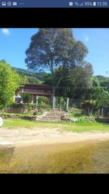 Foto 1 de Casa com 2 Quartos à venda, 130m² em Lagoa da Conceição, Florianópolis