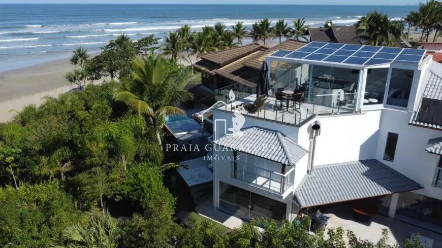 Foto 1 de Casa de Condomínio com 5 Quartos para venda ou aluguel, 300m² em Loteamento Costa do Sol, Bertioga