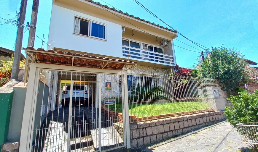 Foto 1 de Casa com 4 Quartos à venda, 249m² em Cavalhada, Porto Alegre