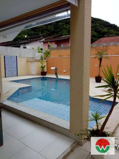 Foto 1 de Casa de Condomínio com 4 Quartos à venda, 280m² em Balneário Praia do Pernambuco, Guarujá