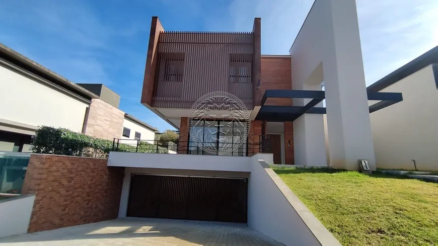Foto 1 de Casa de Condomínio com 4 Quartos à venda, 600m² em Cacupé, Florianópolis