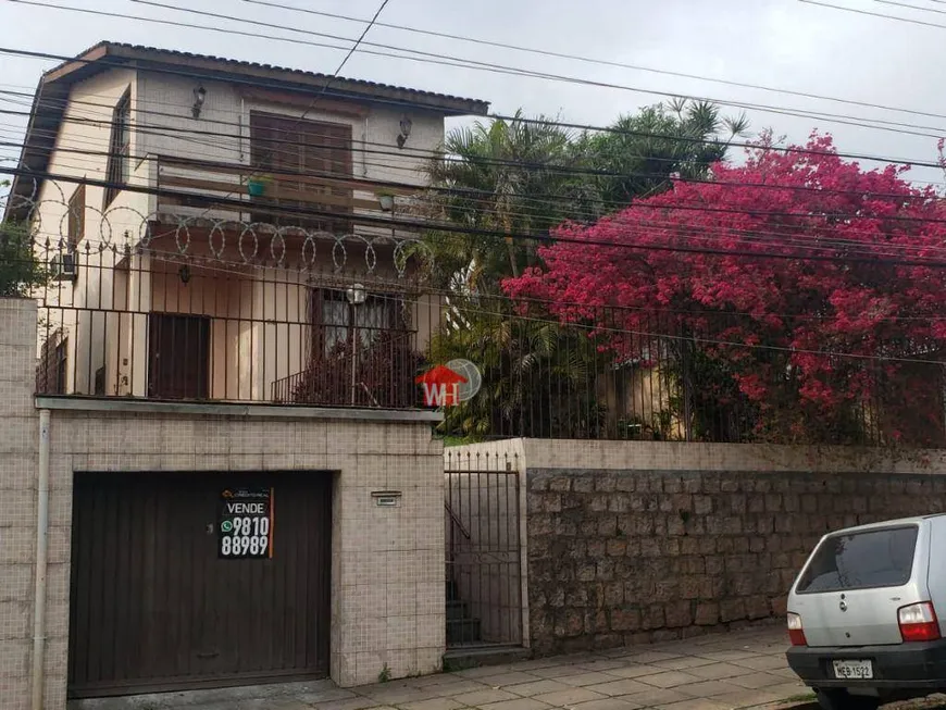 Foto 1 de Casa de Condomínio com 5 Quartos à venda, 100m² em Santo Antônio, Porto Alegre