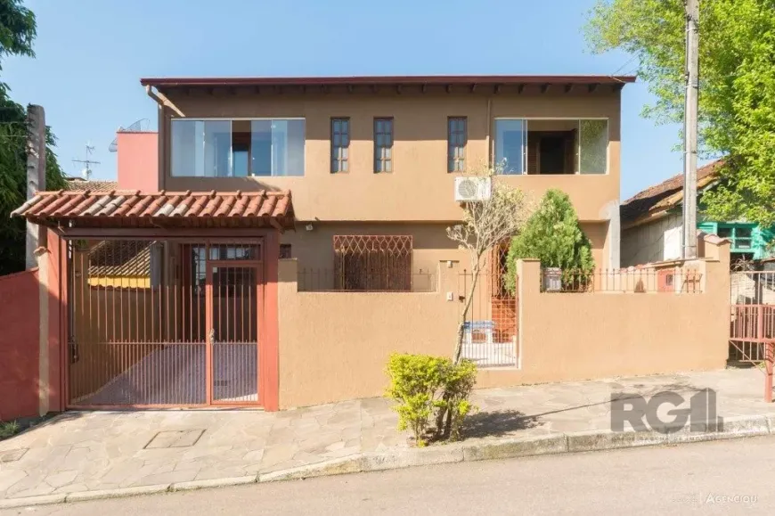 Foto 1 de Casa com 4 Quartos à venda, 266m² em Cavalhada, Porto Alegre