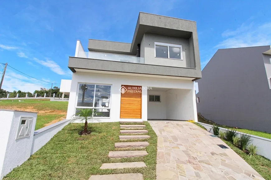 Foto 1 de Casa de Condomínio com 3 Quartos à venda, 180m² em Hípica, Porto Alegre