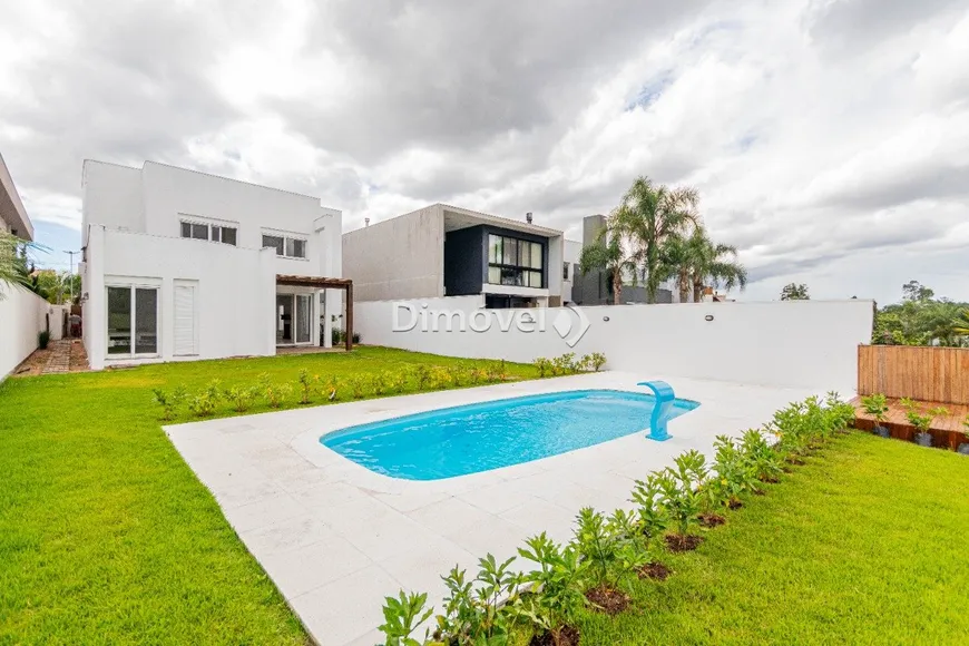 Foto 1 de Casa de Condomínio com 4 Quartos à venda, 334m² em Belém Novo, Porto Alegre