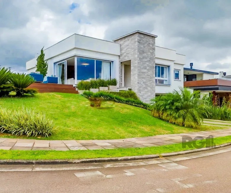 Foto 1 de Casa de Condomínio com 3 Quartos à venda, 261m² em Alphaville, Porto Alegre