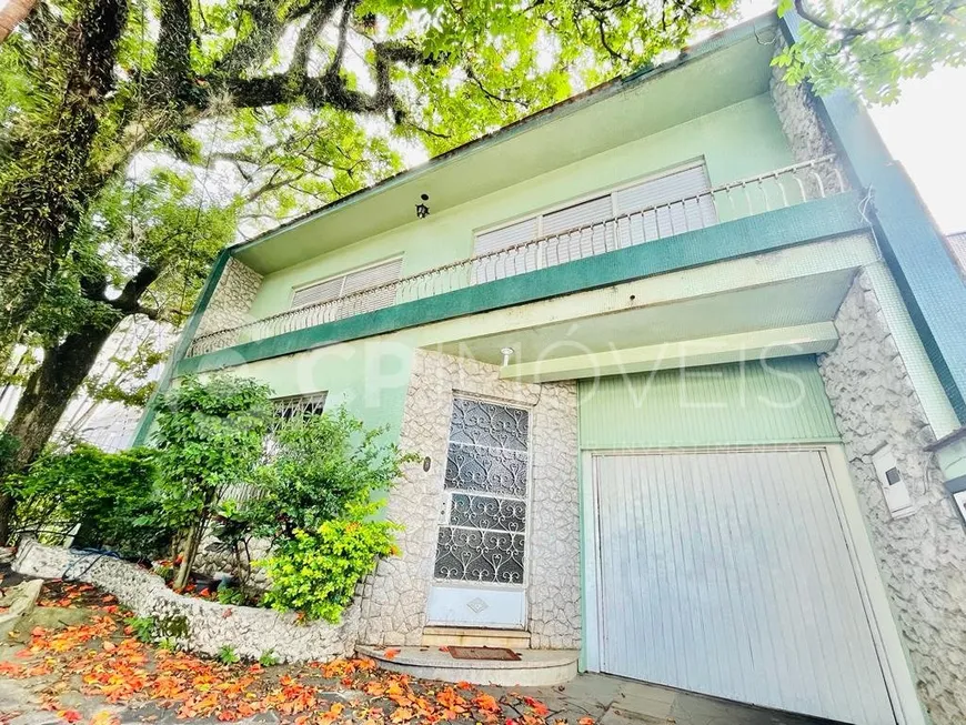 Foto 1 de Sobrado com 4 Quartos à venda, 336m² em Auxiliadora, Porto Alegre