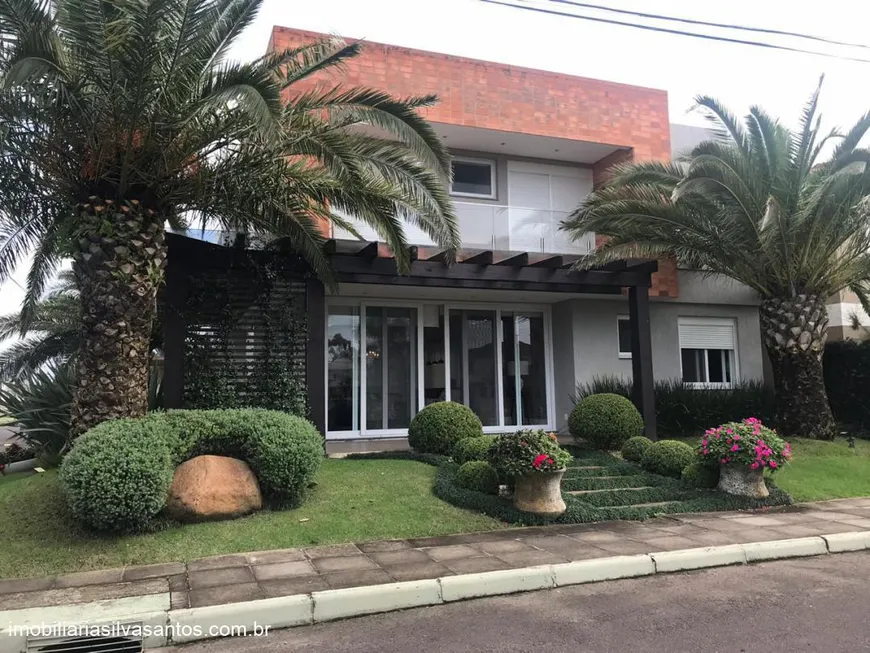 Foto 1 de Casa de Condomínio com 4 Quartos à venda, 210m² em Centro, Capão da Canoa