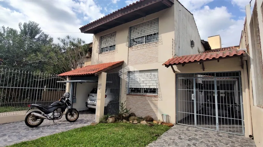 Foto 1 de Casa com 4 Quartos à venda, 173m² em Santa Fé, Porto Alegre