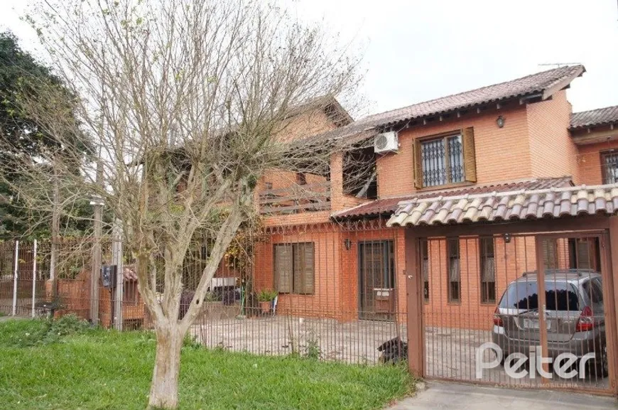 Foto 1 de Casa com 3 Quartos à venda, 206m² em Vila Nova, Porto Alegre