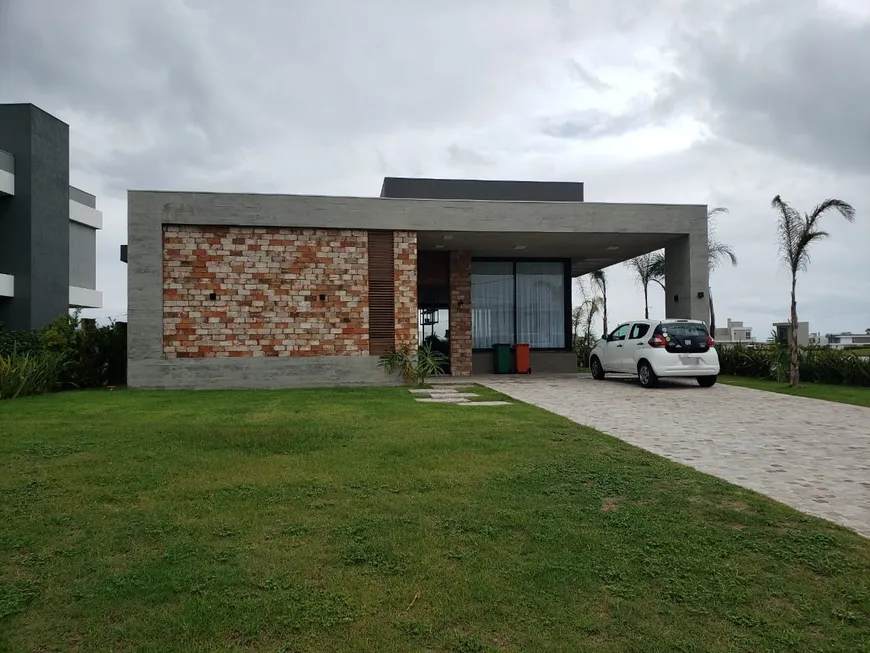 Foto 1 de Casa de Condomínio com 4 Quartos à venda, 240m² em Capao Novo, Capão da Canoa