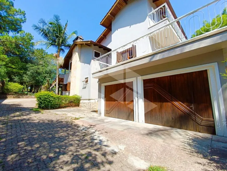 Foto 1 de Casa com 4 Quartos para alugar, 2998m² em Vila Nova, Porto Alegre