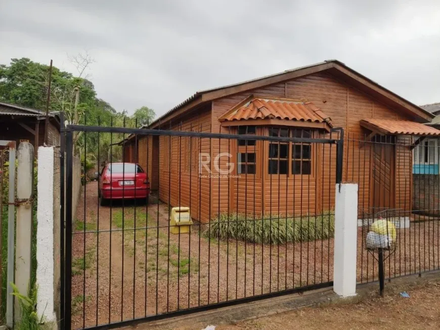 Foto 1 de Casa com 2 Quartos à venda, 44m² em Vila Nova, Porto Alegre