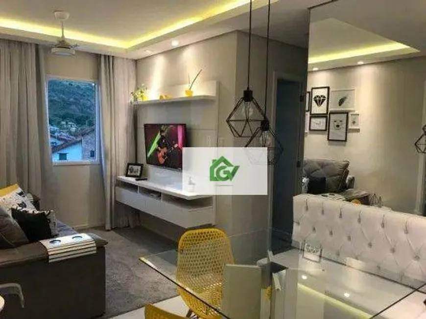 Foto 1 de Apartamento com 2 Quartos à venda, 48m² em Martim de Sa, Caraguatatuba